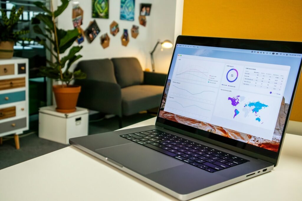 Digital marketing analytics and social media stats on a laptop screen in an office