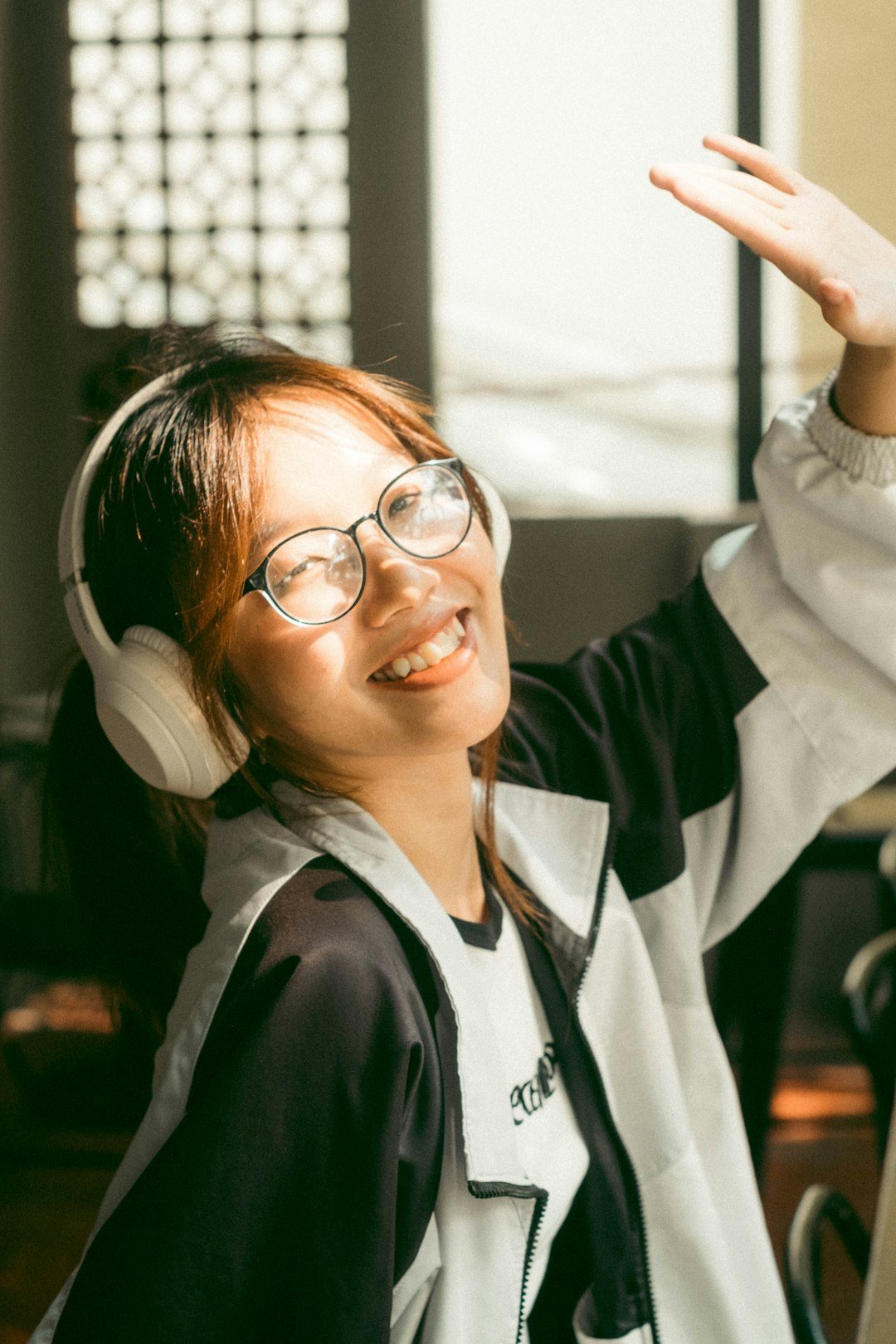 Support team member with a headset speaking and gesturing warmly