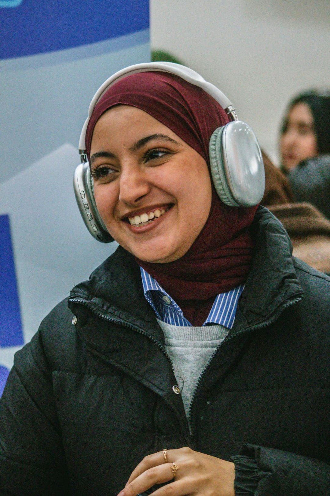 Smiling support team member wearing a headset ready to help